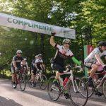 A group of cyclists crossing the finish line of GIRO.