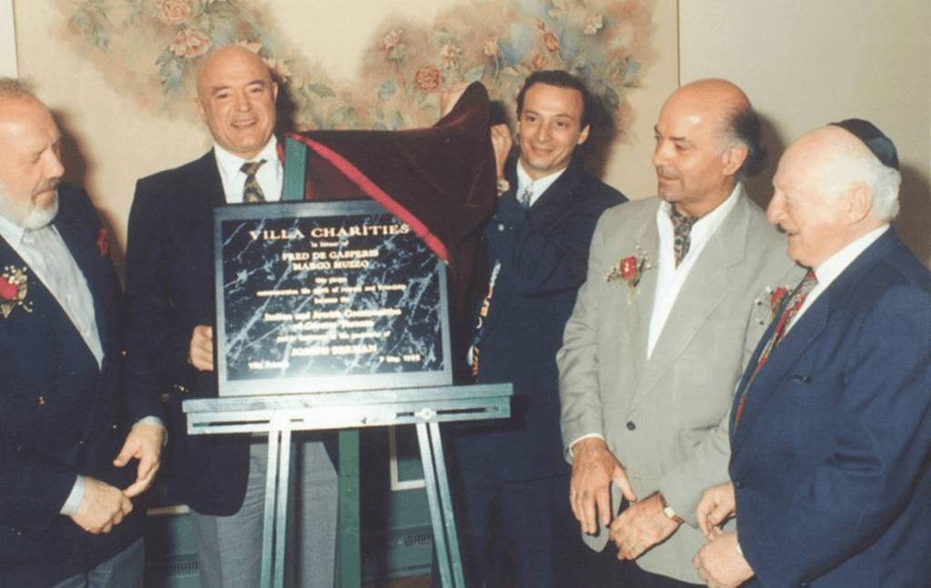 Businessman Joseph Burman (right) honoured long-standing volunteers Marco Muzzo (left) and Fred DeGasperis (second from right)