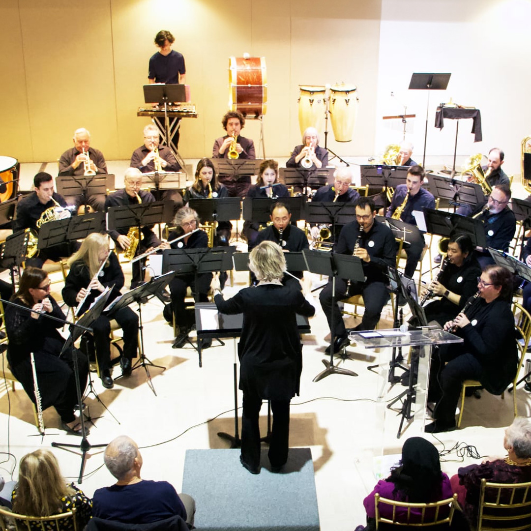 Columbus Concert Band seen performing at the Joseph D Carrier Art Gallery, Columbus Centre, with a crowd watching them