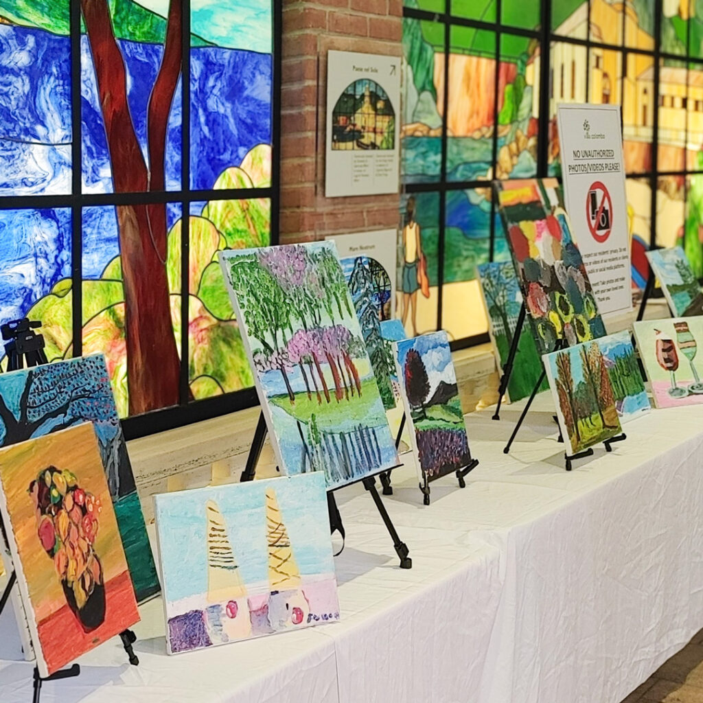 Small paintings seen across table