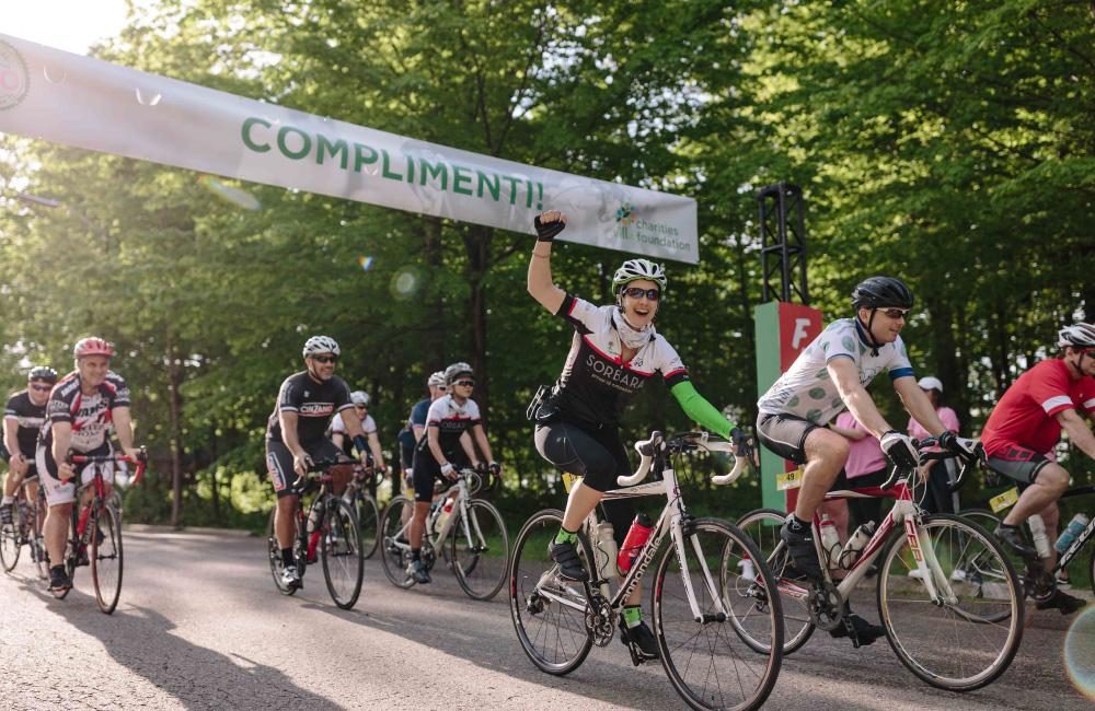 A group of cyclists crossing the finish line of GIRO.